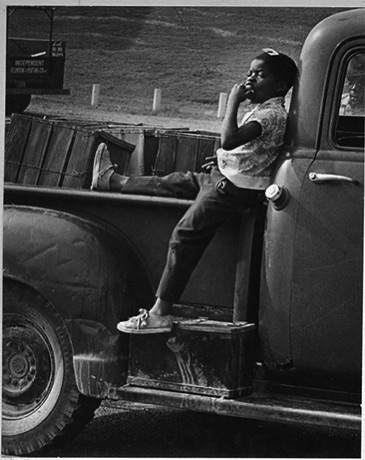 Girl sitting on truck